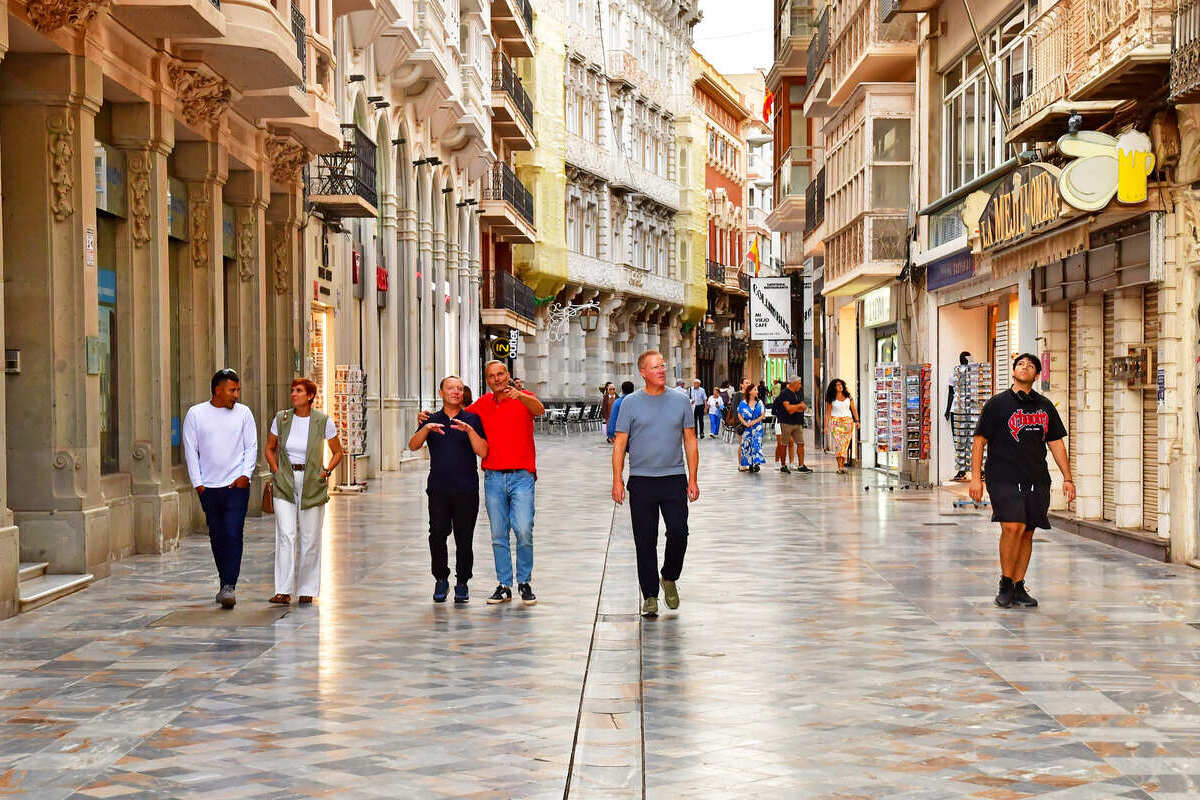 Tourists Walking A Street In Central Cartagena, Spain