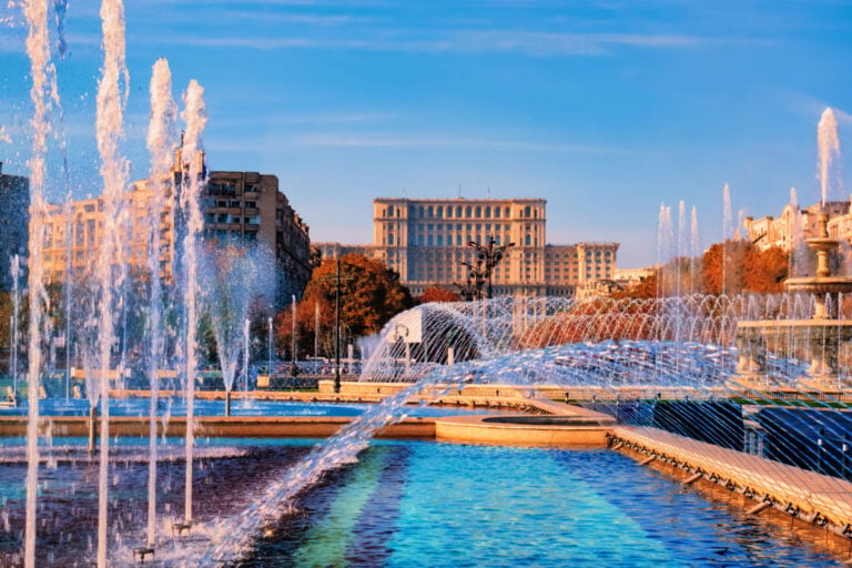 Famous building of Parliament house in Bucharest, the bigest landmark of Romania near the new fountains of capital.