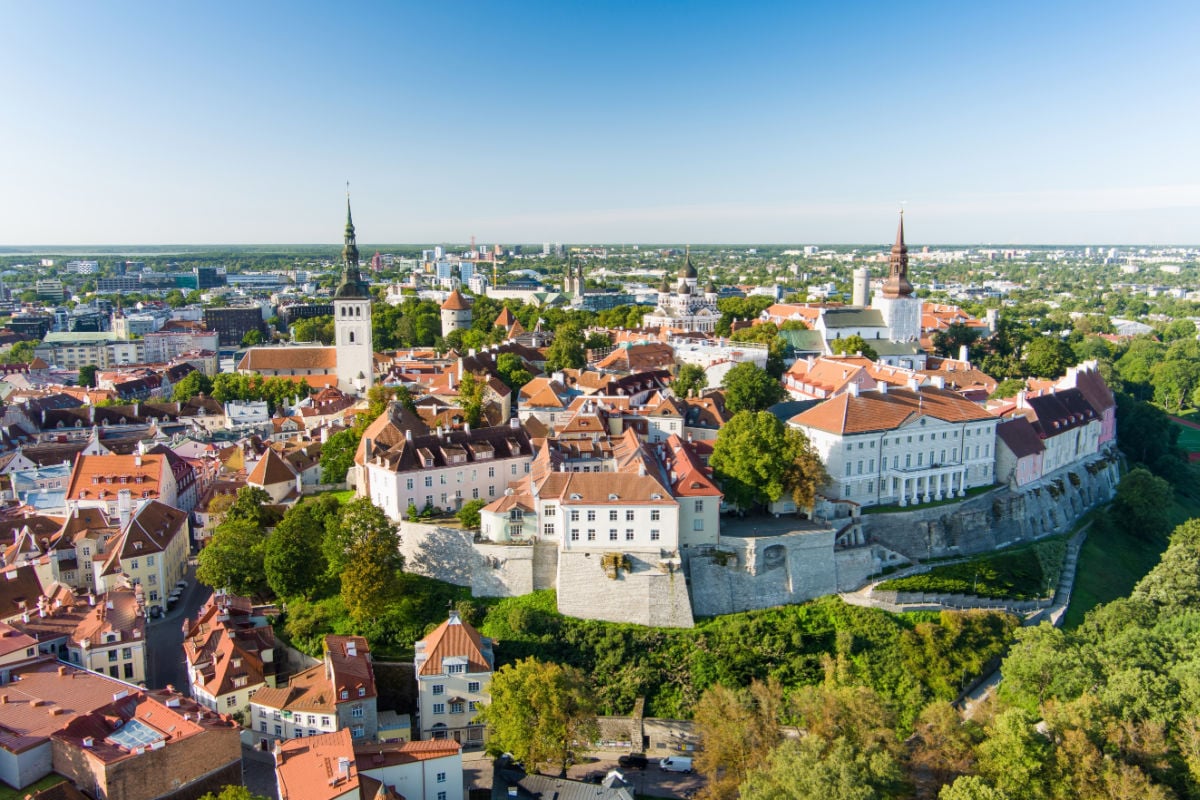 Iconic aerial skyline view of Tallinn Old Town and Toompea hill on a sunny summer evening. Stenbock House, Patkuli viewing platform, defensive walls, rooftops. UNESCO World Heritage site, Estonia
