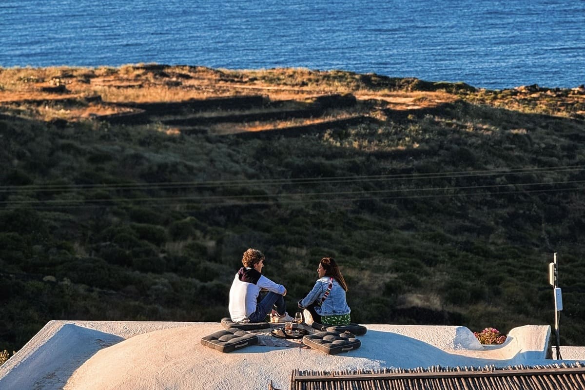 Tourists Enjoying A Picnic In Pantelleria, Italy