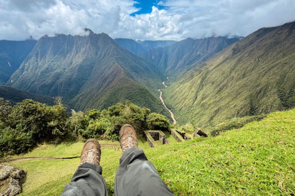 Tyler Fox overlooking mountains and ruins in Peru on the Inca Trail