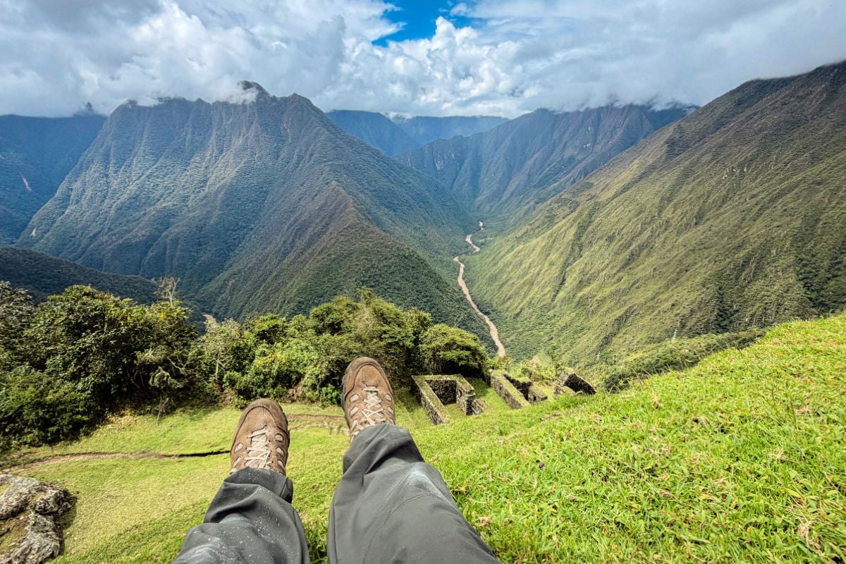 Tyler Fox overlooking mountains and ruins in Peru on the Inca Trail