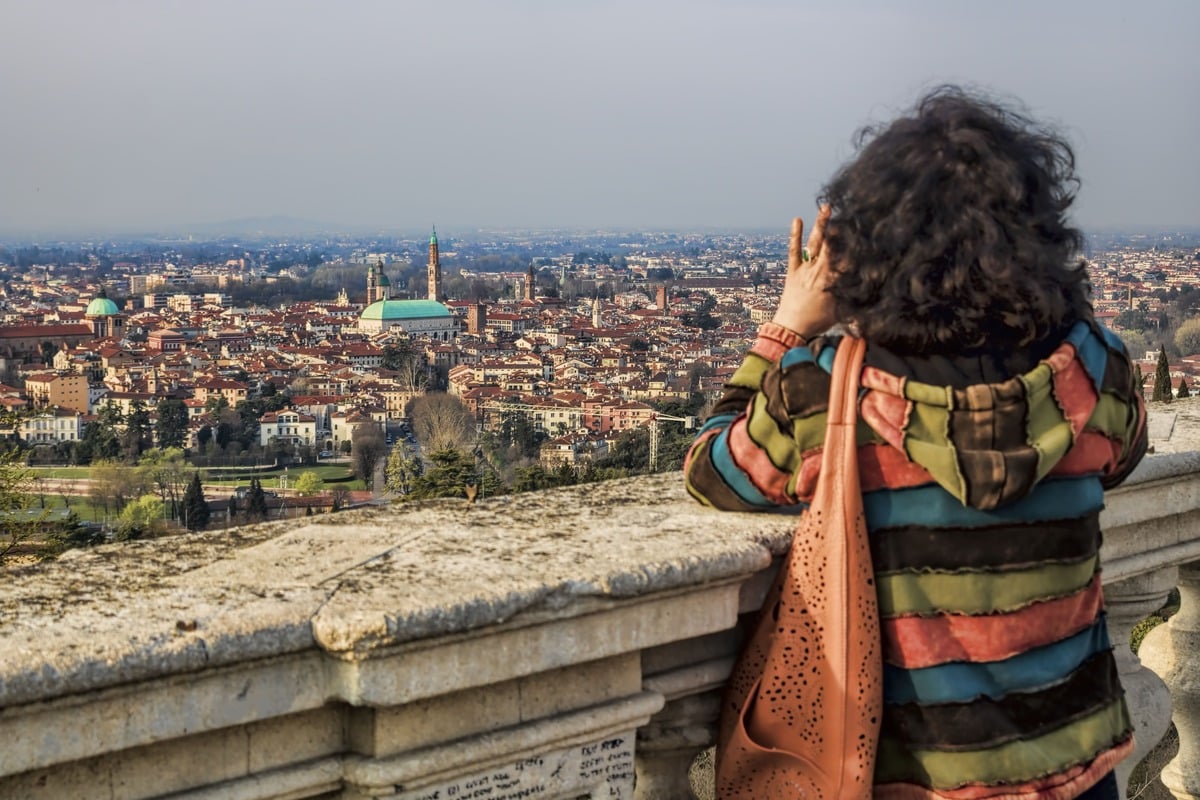 A Woman Taking A Photo Of Vicenza From A Viewpoint, Italy