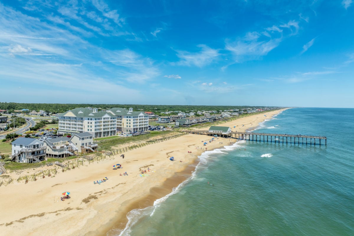 Aerial view of the Kitty Hawk Pier and beach popular tourist vacation destination in the Outer Banks, North Carolina