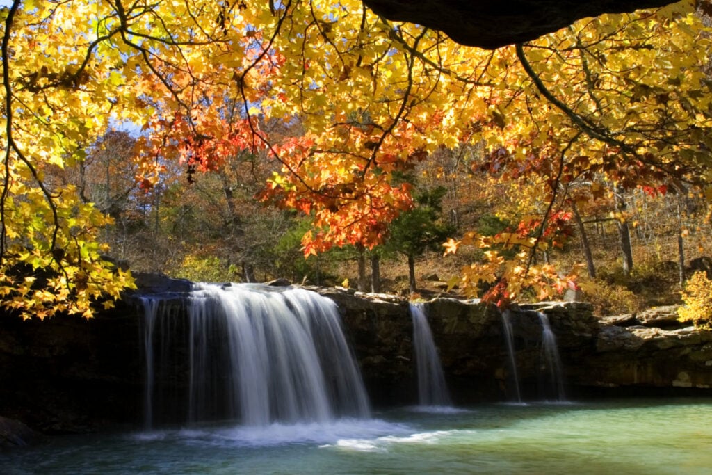Autumn surrounds Falling Water Falls with spectacular fall colors on the leaves. Ozark National Forest, Arkansas