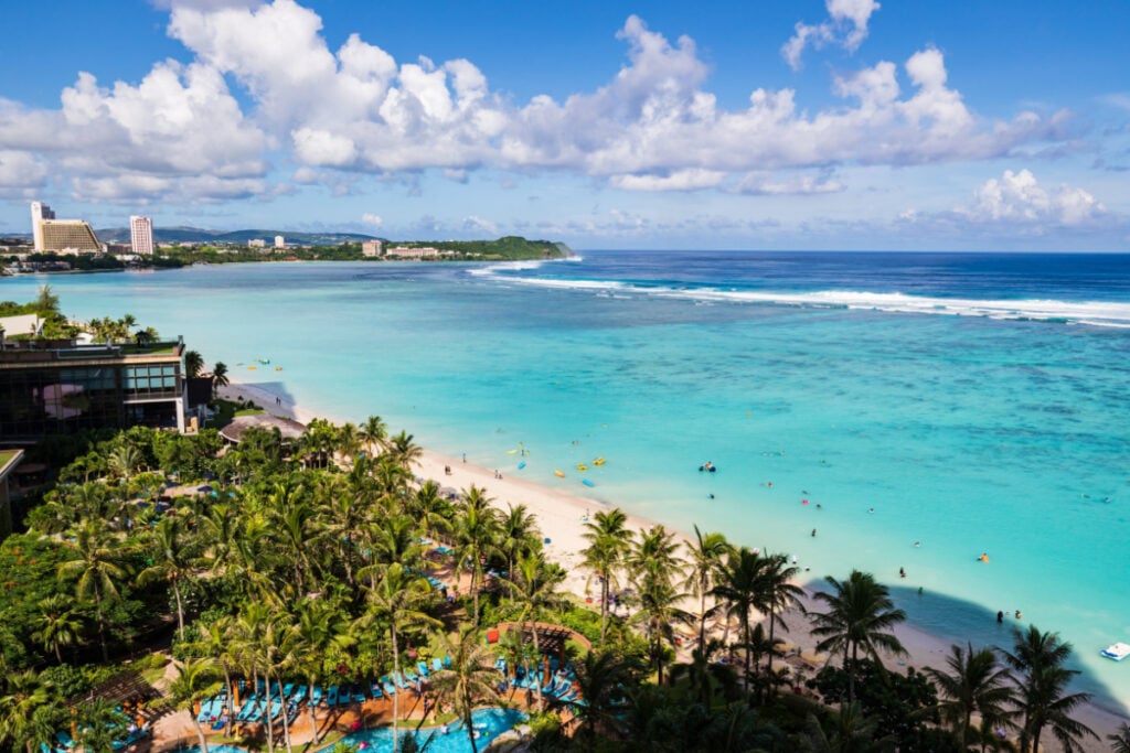Breathtaking View of Tumon Bay with Clear Blue Waters and Palm Trees in Guam