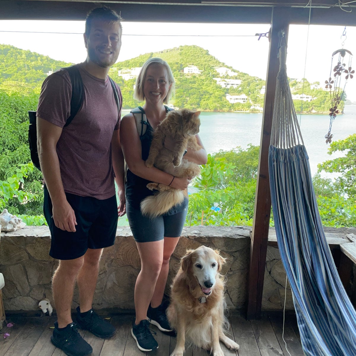 Front porch of Grenada home of Tyler and Liz Fox with pets Nala and Cat