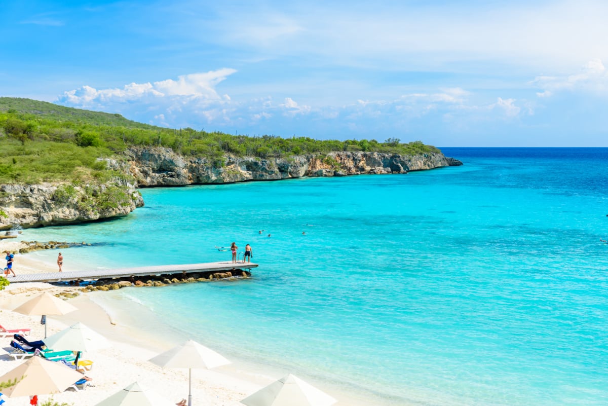 Porto Marie beach - white sand Beach with blue sky and crystal clear blue water in Curacao, Netherlands Antilles, a Caribbean Island