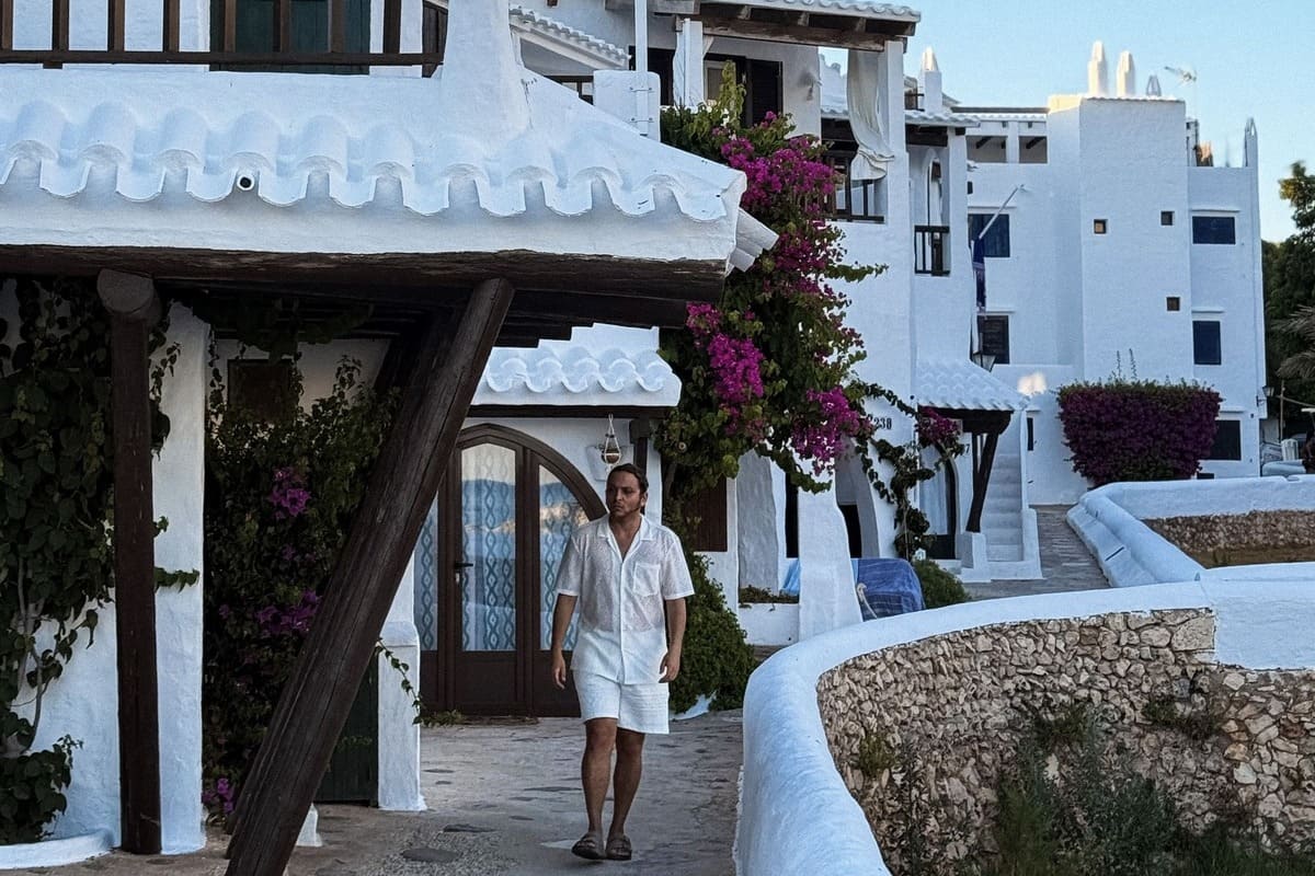 Tourist Walking In Binibeca Vell, Menorca, Spain. Photo by Vinicius Costa