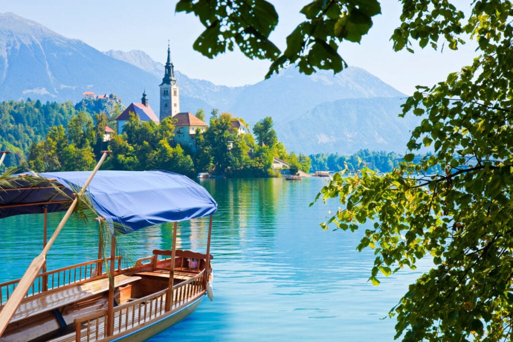 Typical wooden boats, in slovenian called Pletna, in the Lake Bled, the most famous lake in Slovenia with the small island of the church