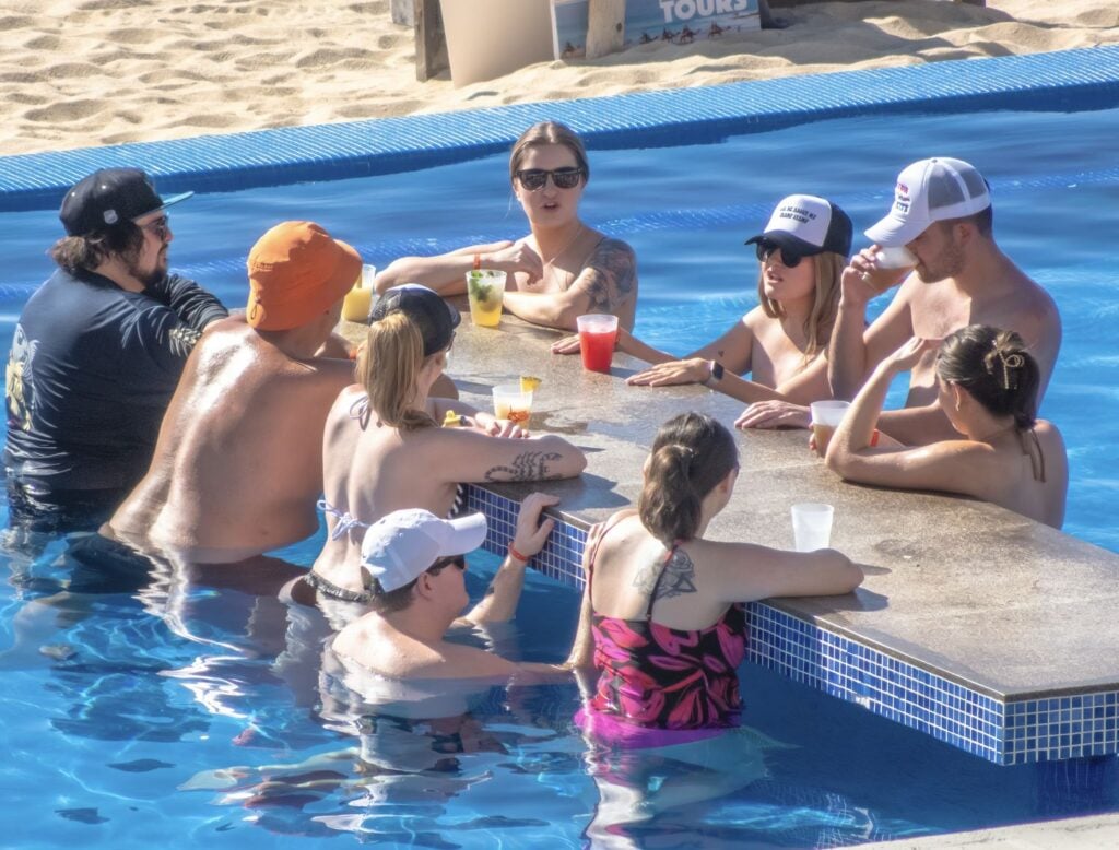 US Travelers Enjoy a resort pool swim up bar in Los Cabos Mexico