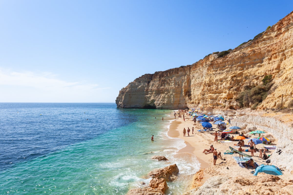 Vale de Centeanes beach, a sandy beach surrounded by cliffs near the seaside town of Carvoeiro in the southern region of the Algarve, Portugal
