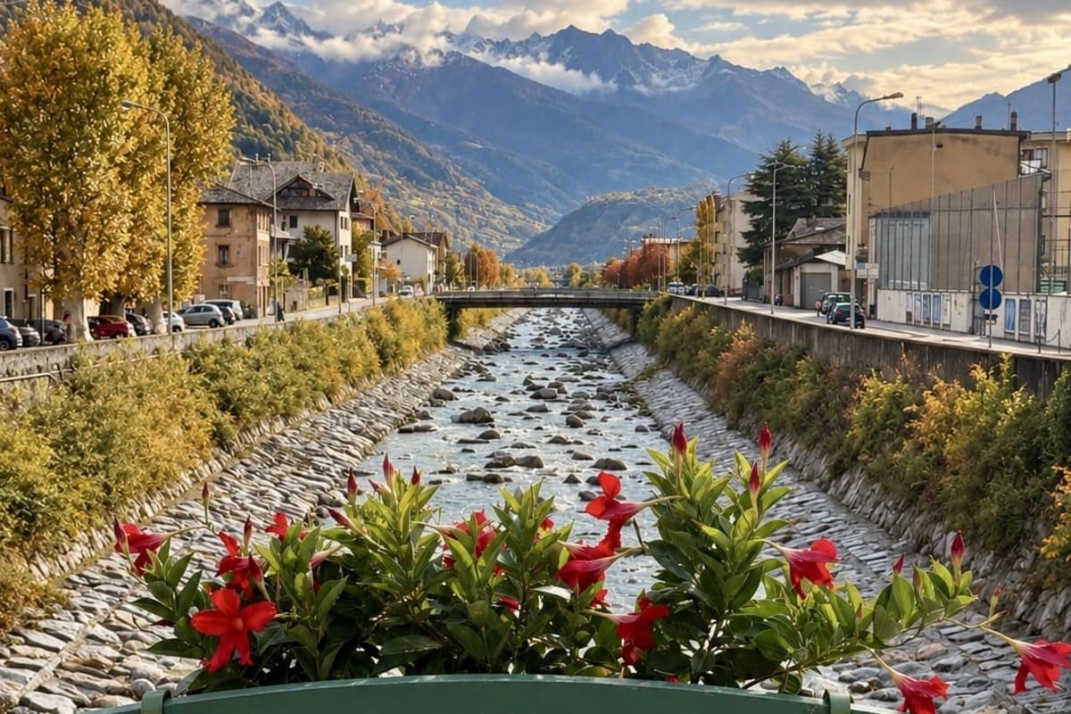 A Metal Bridge With Flower Pots Spanning The Adda River In Tirano, Lombardy, Italy, Near The Border With Switzerland