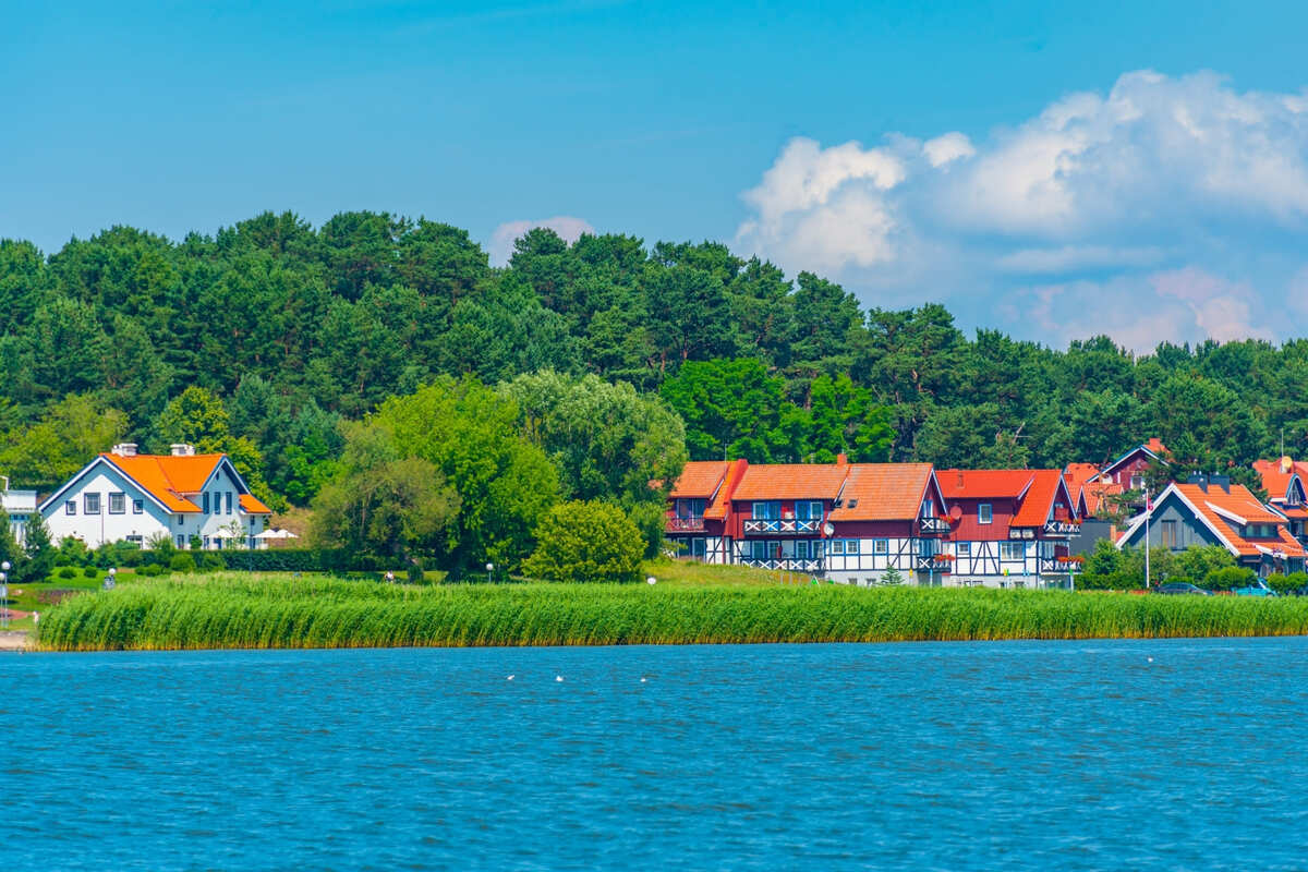 Colorful Houses In Nida, A Lithuanian Village In The Curonian Spit, Lithuania, Baltic Coast Of Europe