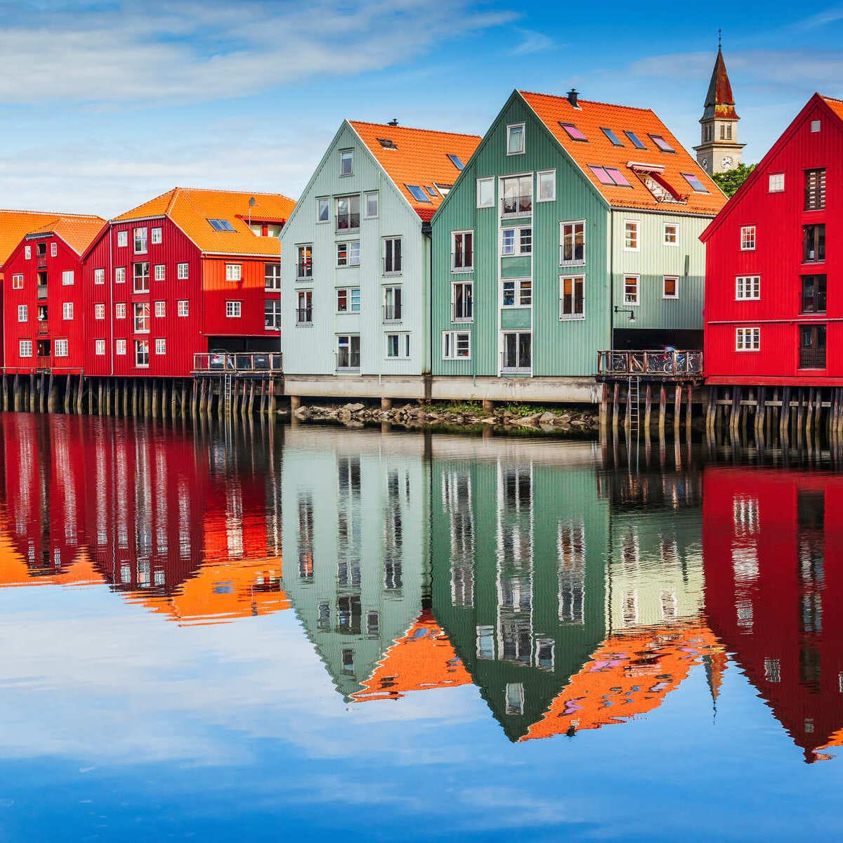 Historic Houses Reflecting On The Water In Trondheim, Norway