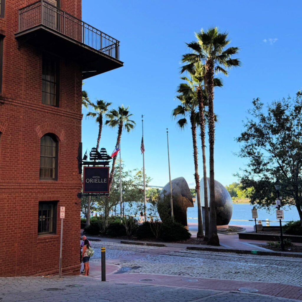 Hotel Orielle, Savannah Georgia, photo showing hotel with river in the background. Photo by Liz Fox