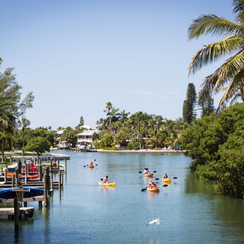 Kayakers floating in a canal on Anna Maria Island, Florida