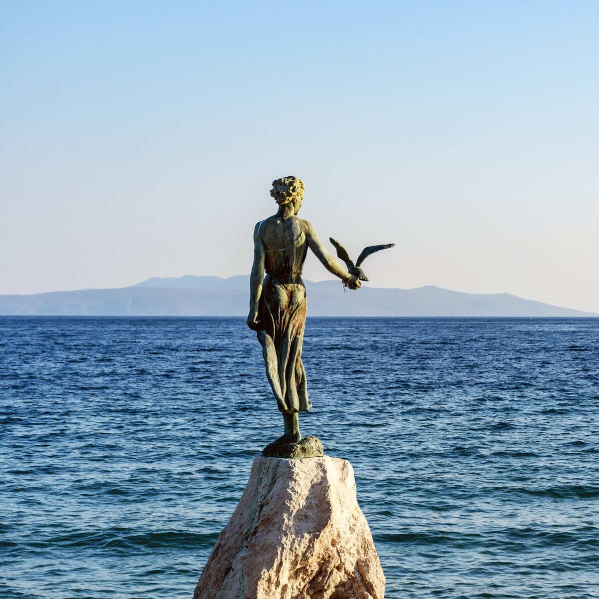 Maiden with the Seagull Sculpture In Opatija, Croatia