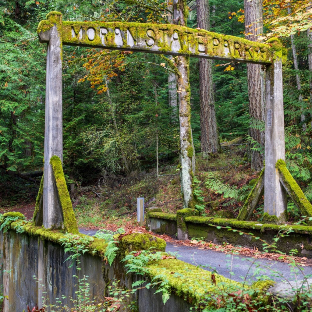 Moss covered old entrance arch to Moran State Park. The park has over 5,000 acres of various terrain including forests, wetlands, bogs, hills, and lakes.