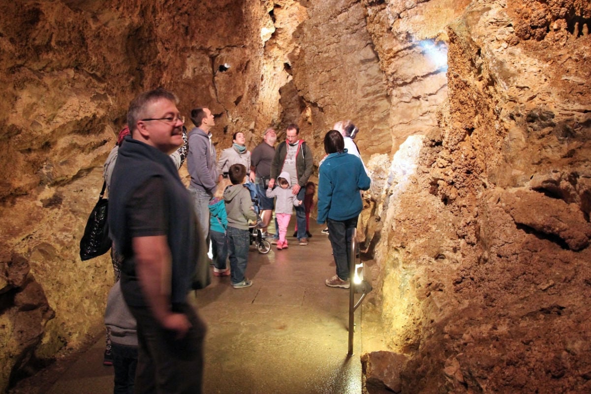 People visit Palvolgyi Cave in Budapest. Budapest has the largest thermal water cave system in the world