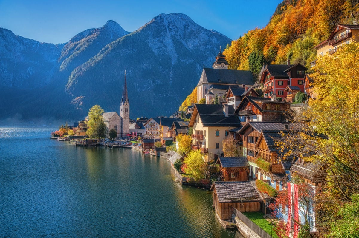 Scenic picture-postcard view of famous Hallstatt mountain village with Hallstatter See in the Austrian Alps in beautiful golden morning light in fall, region of Salzkammergut, Austria