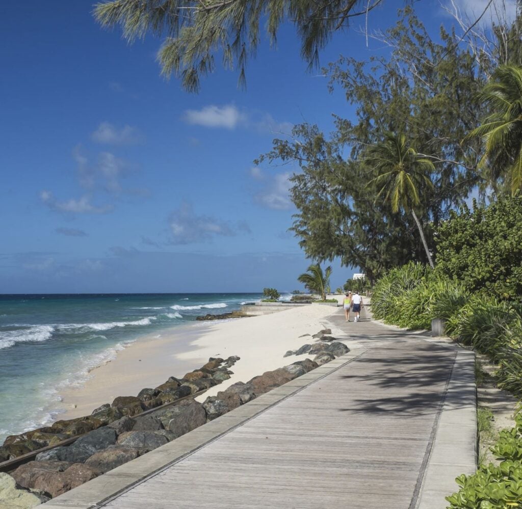 South coast wooden boardwalk running along part of the coastline at Accra Beach, Barbados, West Indies.