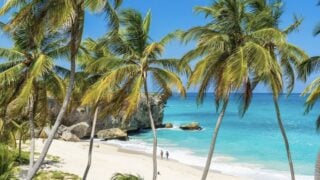 This English-Speaking Caribbean Island With 80 White Sand Beaches, 83°F Winters, And $5 Rum Punch Is Breaking Tourism Records