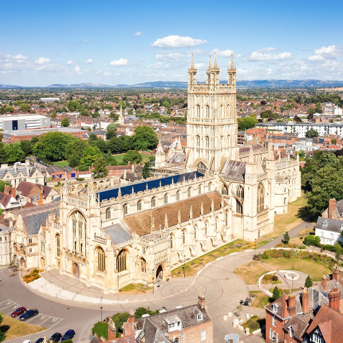 Aerial view of Gloucester Cathedral Church of St Peter and the Holy and Indivisible Trinity on a sunny day.