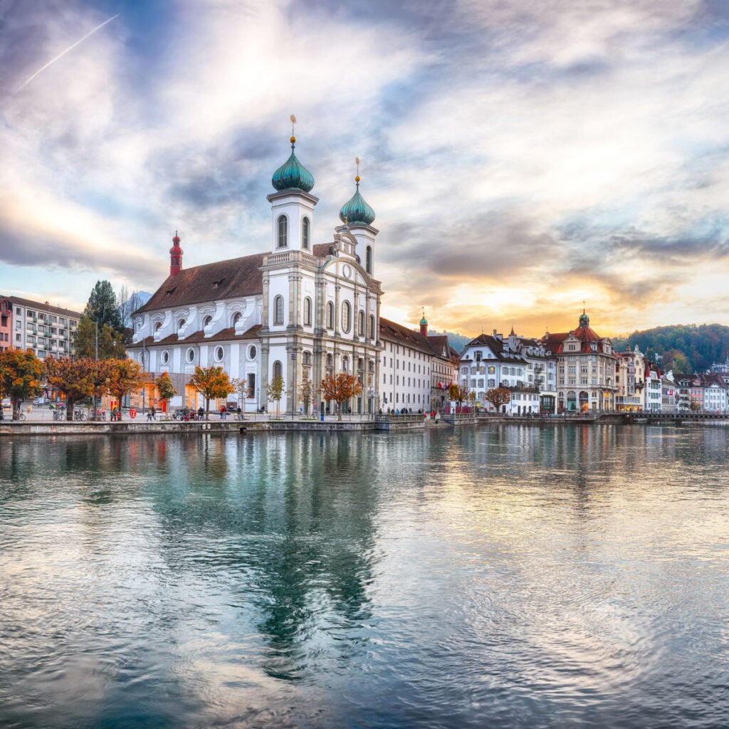 Amazing historic city center of Lucerne with famous buildings and lake Jesuitenkirche Church. Popular travel destination Lucerne, Canton of Lucerne, Switzerland, Europe
