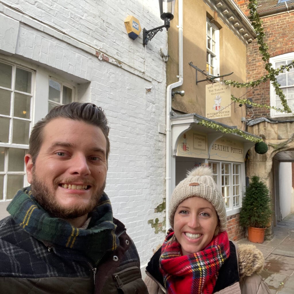 Liz and Tyler Fox in front of Tailor of Gloucester House