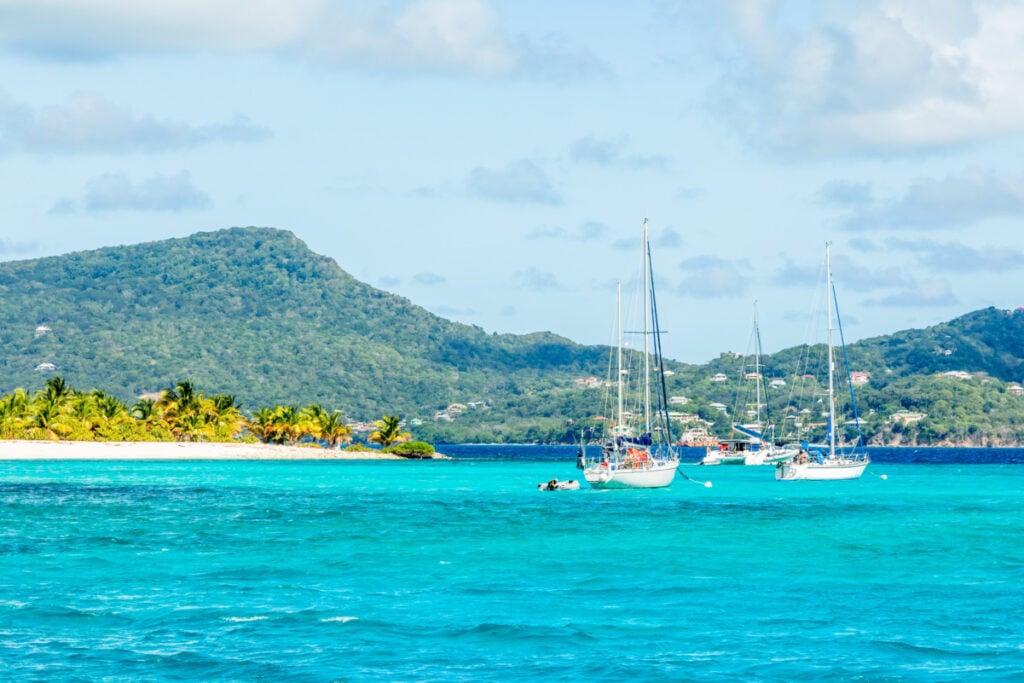 Turquoise sea and anchored yachts near Carriacou island, Grenada, Caribbean sea
