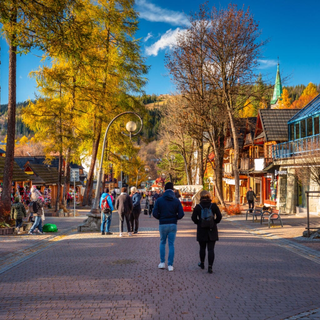 Zakopane People on the main Krupowki street in Zakopane at autumn. Krupowki street is the main shopping and restaurant area in Zakopane, Poland.